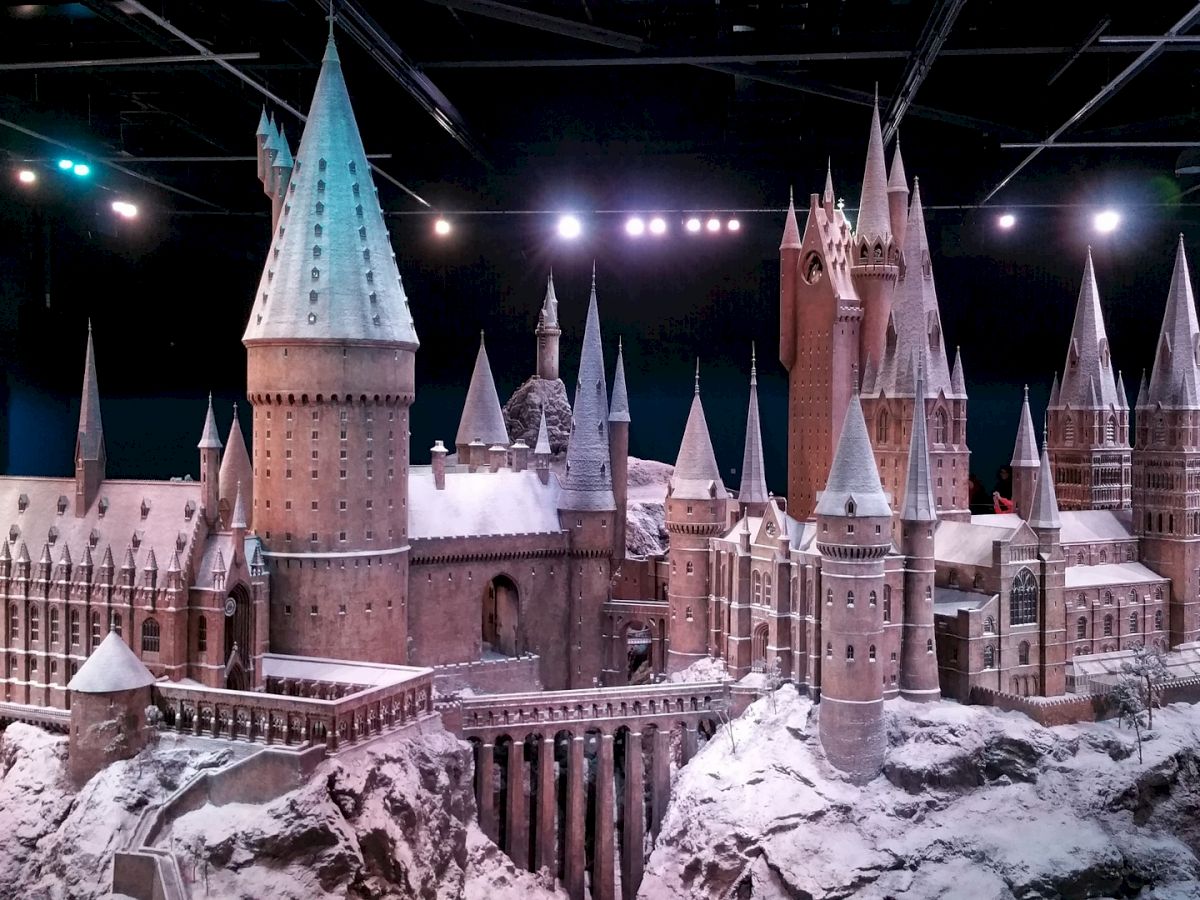 The image shows a detailed model of a snow-covered, castle-like structure with numerous spires and towers, likely from a fantasy setting.